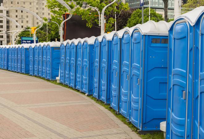 colorful portable restrooms available for rent at a local fair or carnival in Carmel